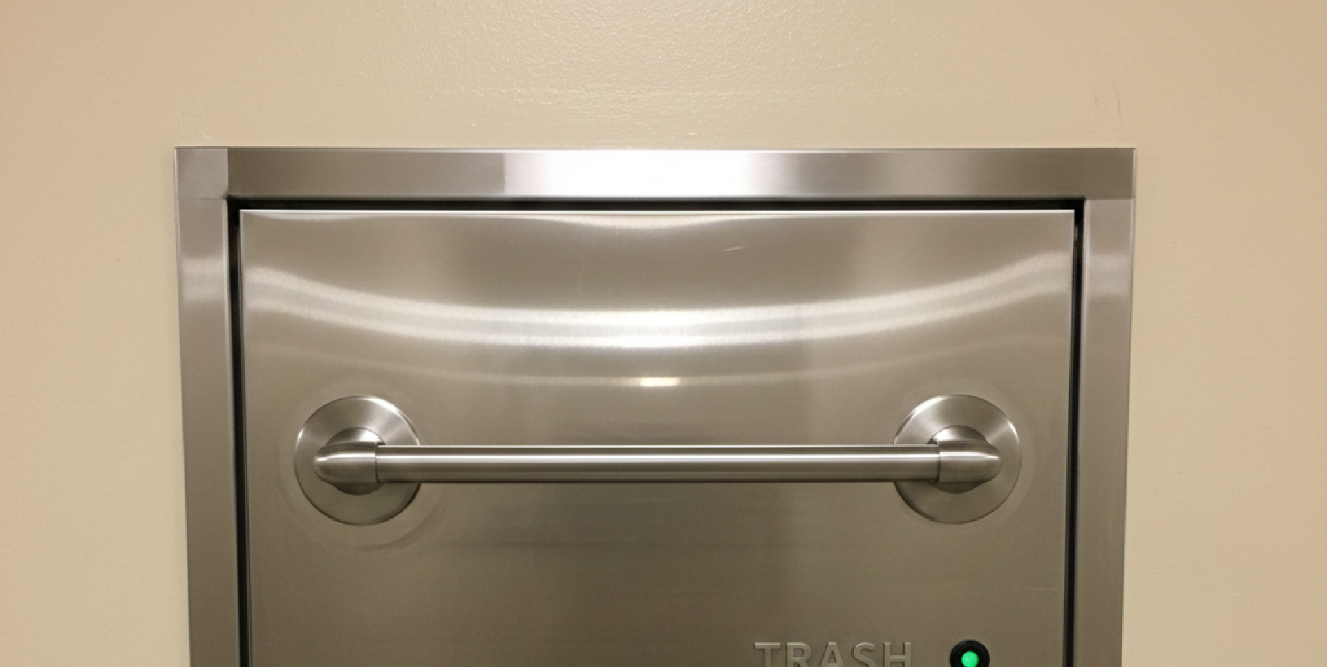 A touching moment of a mother kissing her daughter indoors, radiating love and warmth.