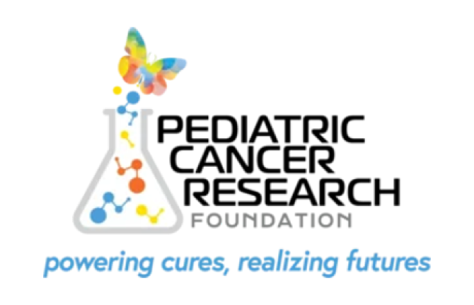 Vibrant orange bin with blue lid situated outside urban building, capturing urban waste management theme.